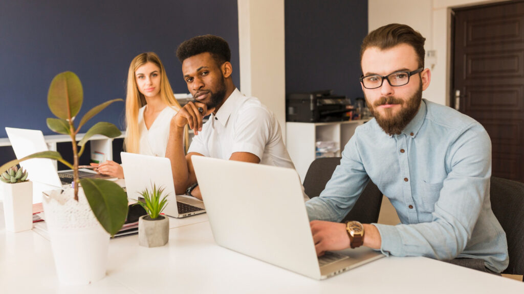 Team of developers at an iOS app development company in Columbia working on Swift-based app designs